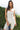 nude tank top and capri pants with black polka dot pattern on a white background