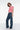 dark wash jean with stud details at hip and midcalf