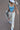 blue corset with orange lace-up details at sides