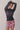 sheet navy sweater with ribbed waist and mini skirt with red-and-white hawaiian print