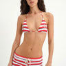 red black and white striped triangle top with star-shaped grommets and red black and white striped boyshort swim bottom with cream-colored rope drawstring