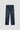 Blue jeans with decorative studs on a light gray background