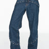 dark wash jean with stud details at hip and midcalf