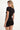 black shortsleeve knit romper with mother of pearl buttons at bust and waist
