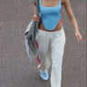 blue corset with orange lace-up details at sides