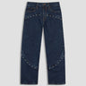 dark wash jean with stud details at hip and midcalf