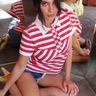short sleeve polo button-up shirt with white collar and red, white, and black stripes 